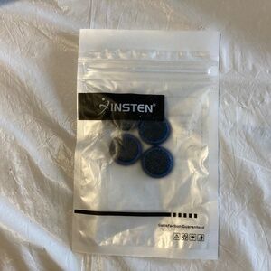 Four Black and Blue Thumb Button Covers for Nintendo Switch/Lite